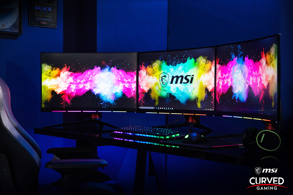 triple monitor setup with one curved